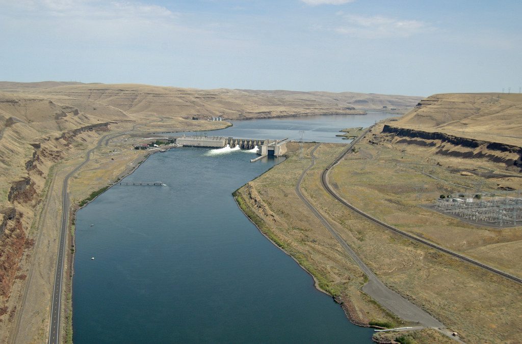 Aerial view of a dam and reservoir on the Snake River.